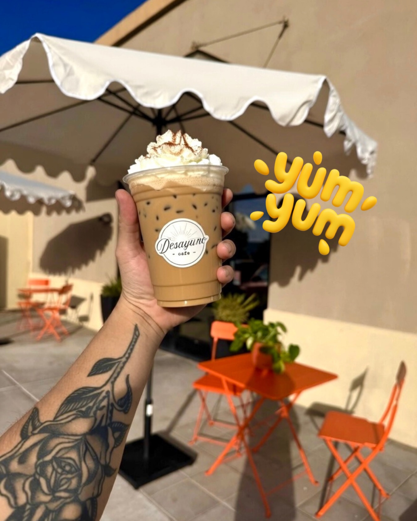 Iced latte with whipped cream on the patio