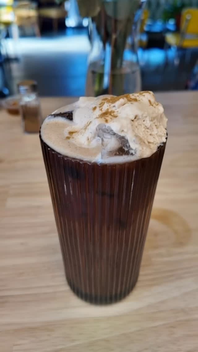 Tall iced mocha topped with whipped cream
