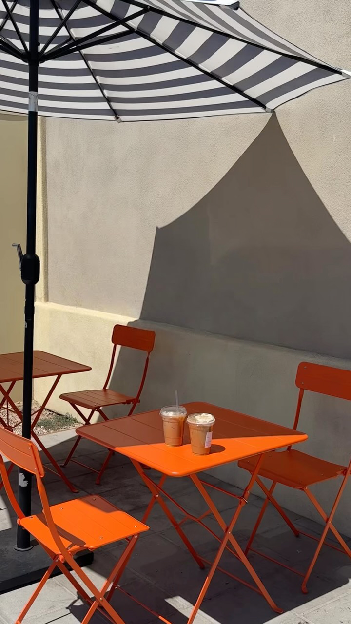 Two iced coffees on the orange patio furniture